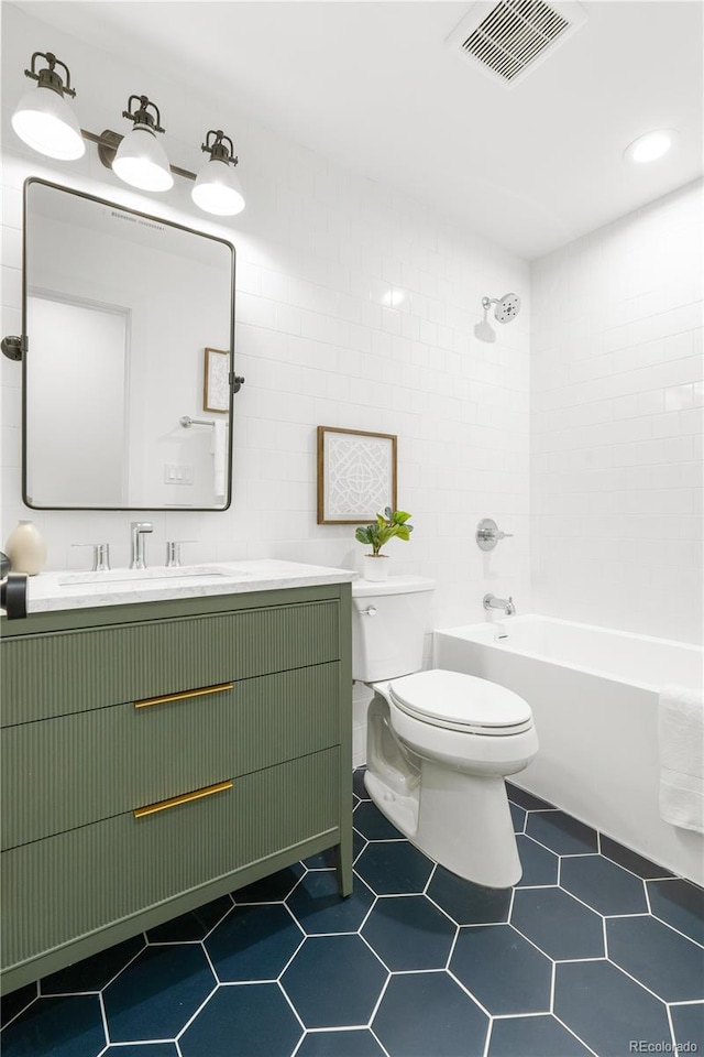 11010 W 29th Ave, Lakewood, CO 80215 - bathroom with vanity, bathtub / shower combination, and tile patterned floors