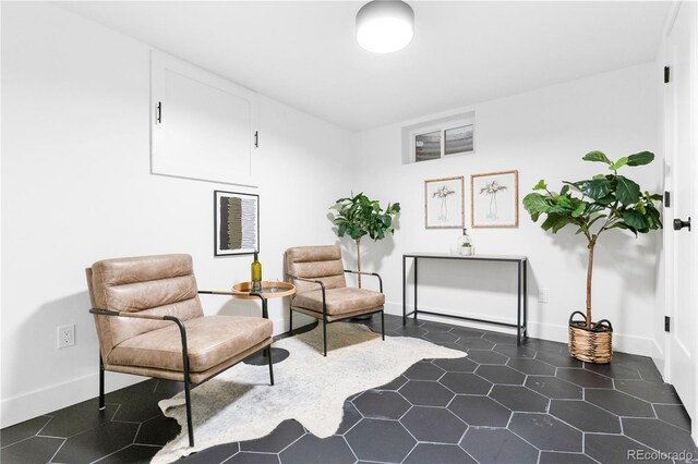 11010 W 29th Ave, Lakewood, CO 80215 - sitting room featuring baseboards and dark tile patterned floors