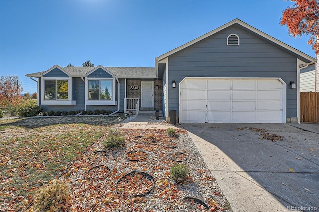 ranch-style home with a garage