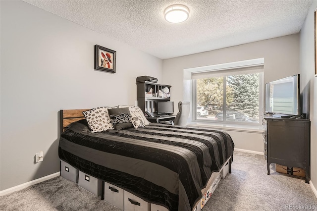 carpeted bedroom with a textured ceiling