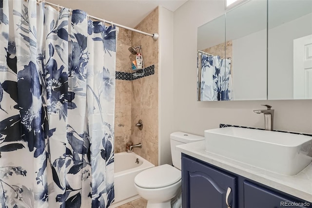 full bathroom featuring shower / bath combination with curtain, vanity, toilet, and tile patterned floors