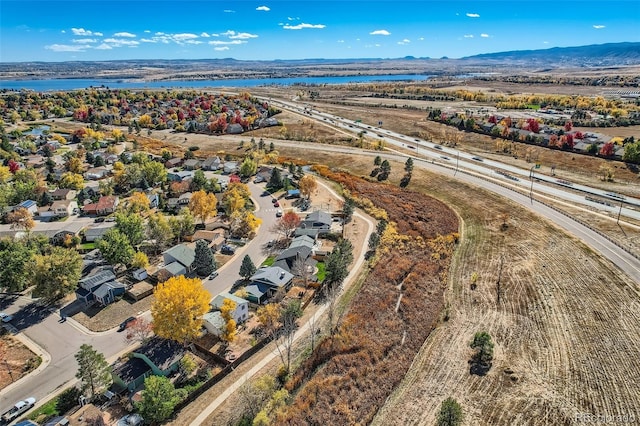 bird's eye view featuring a water and mountain view