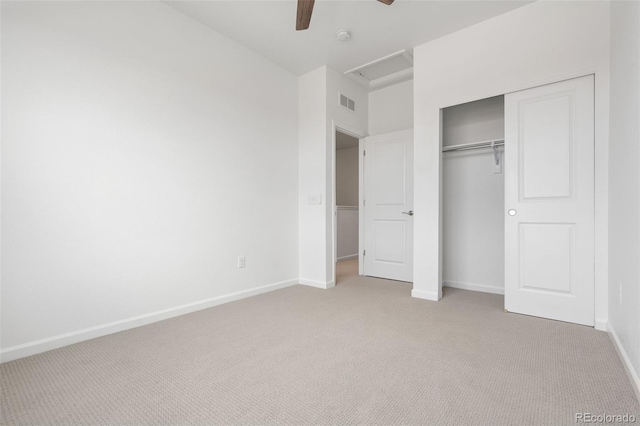 2140 Santini Trl Unit F, Littleton, CO 80129 - unfurnished bedroom with light carpet, a closet, baseboards, attic access, and ceiling fan