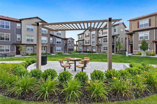 2140 Santini Trl Unit F, Littleton, CO 80129 - view of community with a residential view, a pergola, and a lawn