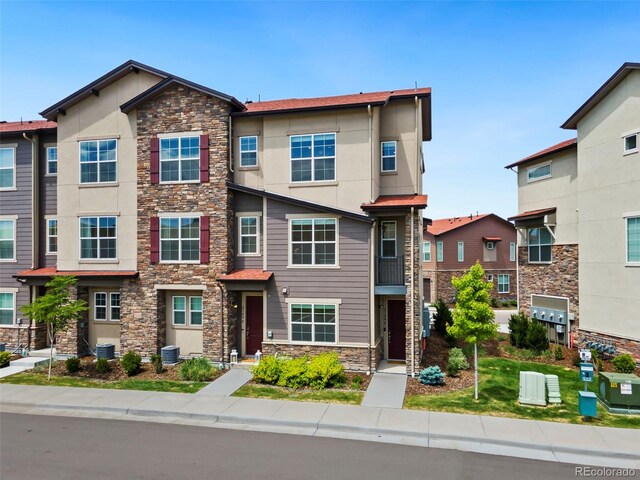 2140 Santini Trl Unit F, Littleton, CO 80129 - view of property featuring stone siding and stucco siding