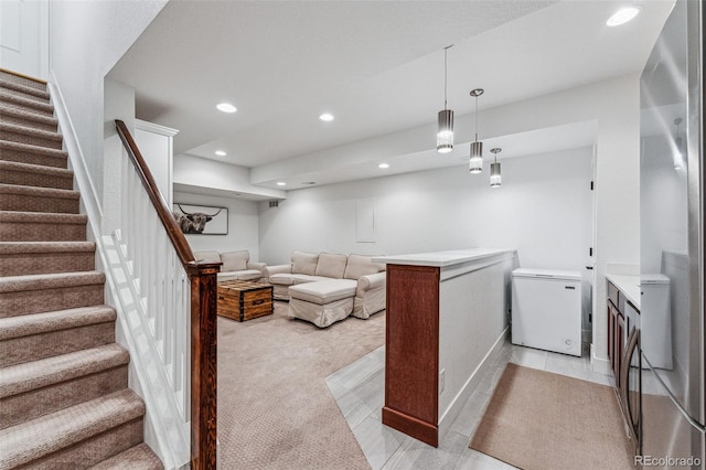 living area featuring stairway and recessed lighting