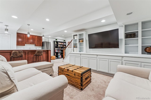 living room with visible vents, stairway, light colored carpet, and recessed lighting