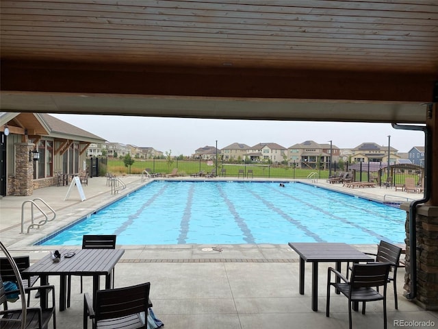 view of pool featuring a patio