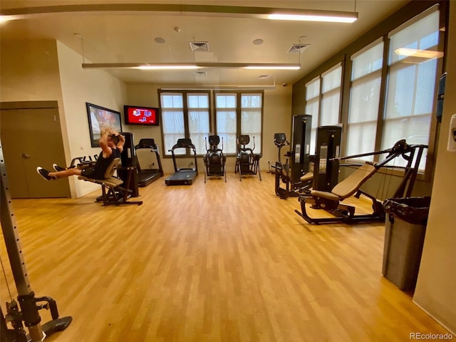 gym with light hardwood / wood-style flooring