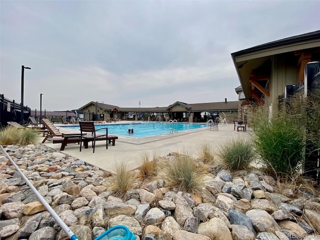 view of swimming pool featuring a patio