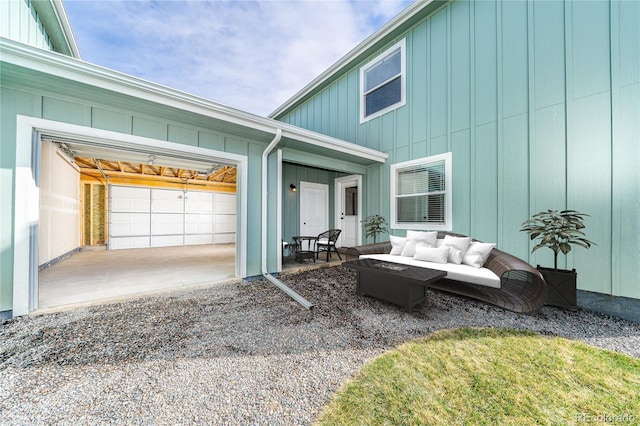 exterior space with an outdoor living space and a garage