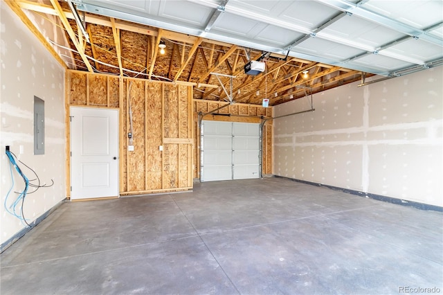 garage featuring a garage door opener and electric panel