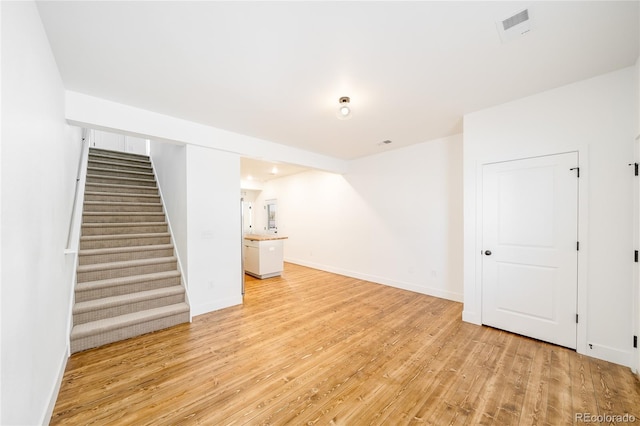 basement featuring light wood-type flooring