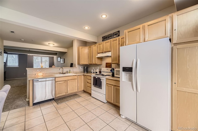 kitchen with light brown cabinetry, a sink, light tile patterned floors, under cabinet range hood, and white appliances