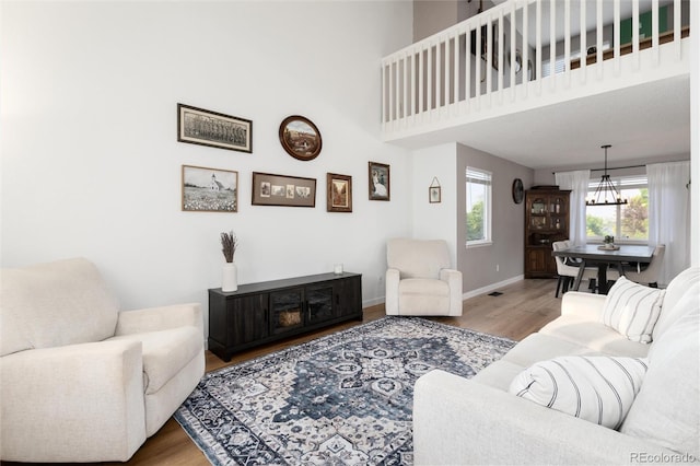 4304 S Genoa Ct, Centennial, CO 80015 - living room featuring wood finished floors and a chandelier