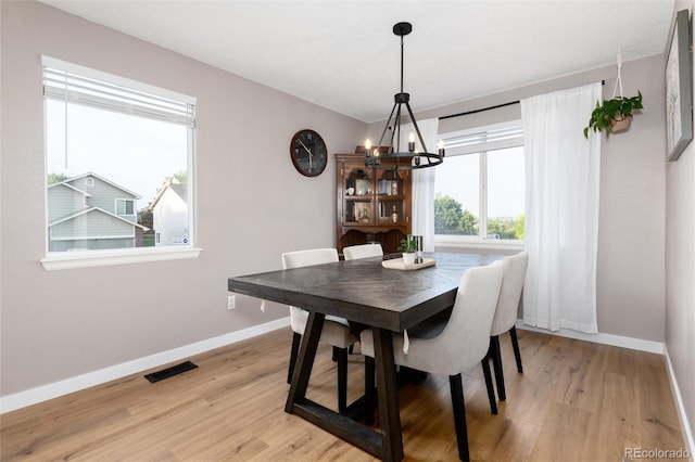 4304 S Genoa Ct, Centennial, CO 80015 - dining space with a chandelier and light wood-type flooring