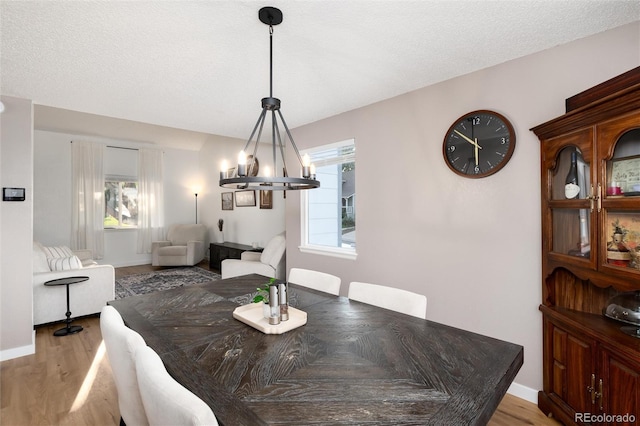4304 S Genoa Ct, Centennial, CO 80015 - dining area with a chandelier and wood finished floors