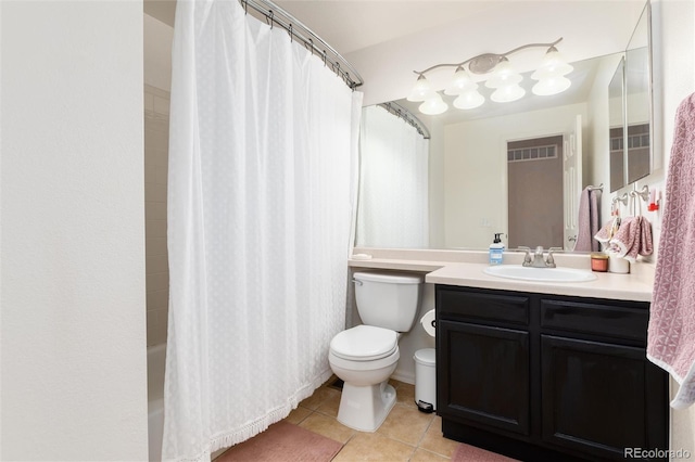 4304 S Genoa Ct, Centennial, CO 80015 - bathroom featuring tile patterned floors, vanity, and shower / bath combo with shower curtain