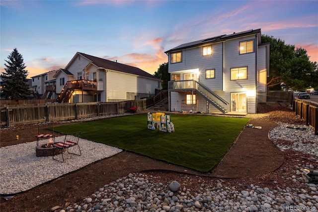 4304 S Genoa Ct, Centennial, CO 80015 - back of house with a fire pit, stairs, a fenced backyard, and a patio