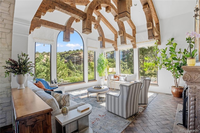 sunroom / solarium with vaulted ceiling with beams