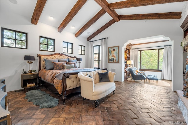 7944 Dante Dr, Littleton, CO 80125 - bedroom featuring arched walkways, high vaulted ceiling, recessed lighting, and beam ceiling