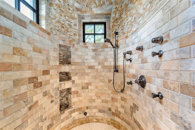 bathroom with tiled shower