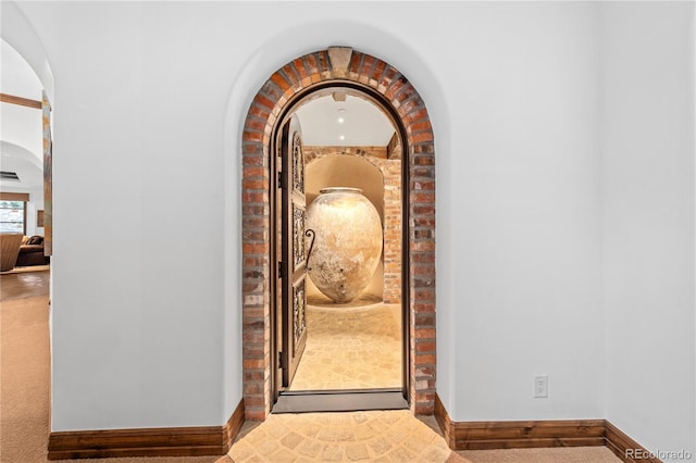 7944 Dante Dr, Littleton, CO 80125 - details featuring arched walkways, carpet, and baseboards