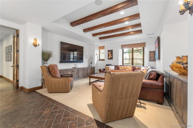 carpeted living room with beamed ceiling