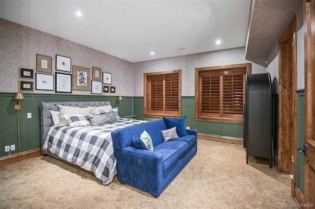 bedroom featuring carpet floors, a wainscoted wall, and recessed lighting