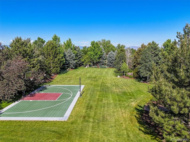 view of basketball court featuring community basketball court and a yard