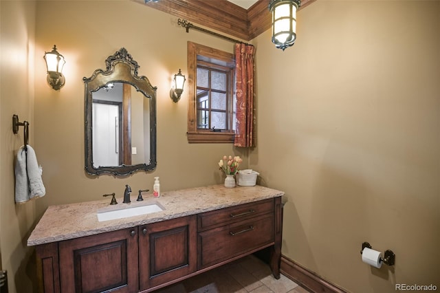 bathroom featuring vanity and baseboards