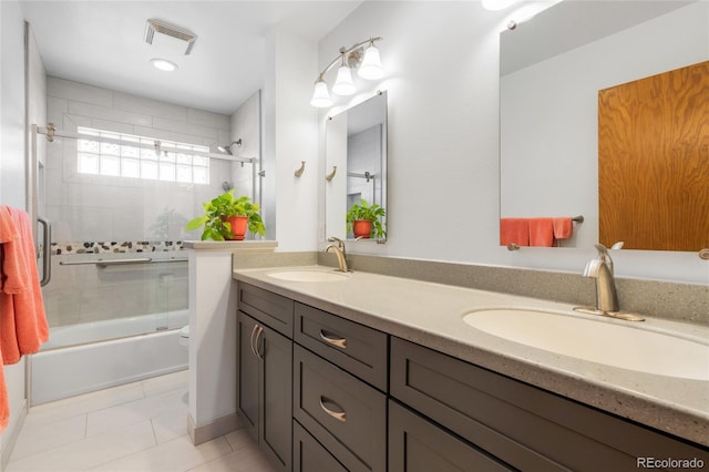 full bathroom with vanity, tile patterned floors, enclosed tub / shower combo, and toilet