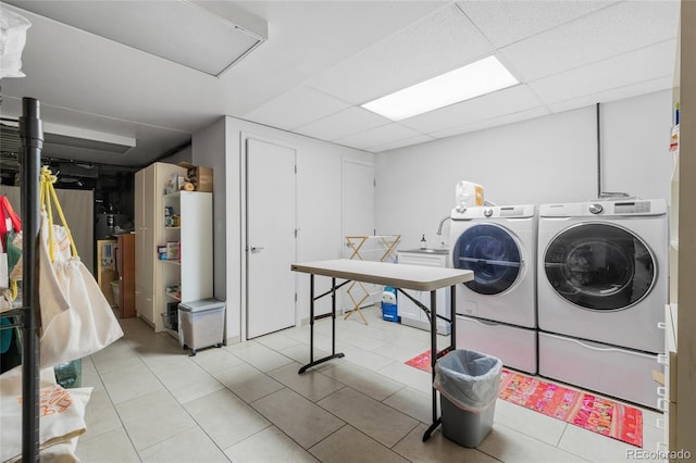 laundry area with light tile patterned floors and independent washer and dryer