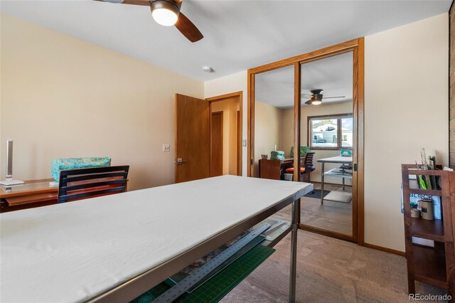 office area with carpet flooring and ceiling fan