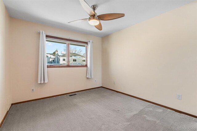 carpeted empty room with ceiling fan