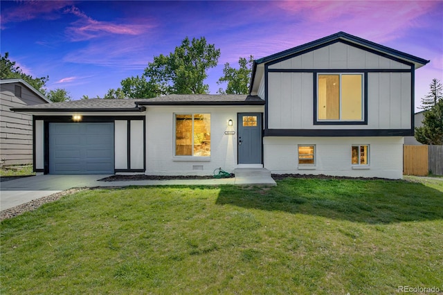9605 Carr St, Broomfield, CO 80021 - tri-level home featuring driveway, brick siding, an attached garage, and board and batten siding