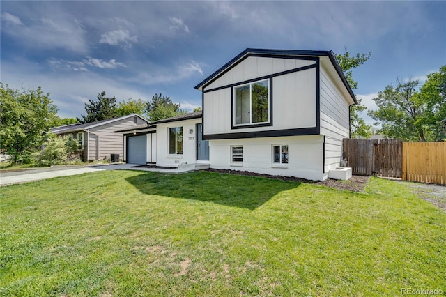 9605 Carr St, Broomfield, CO 80021 - tri-level home featuring concrete driveway and a garage