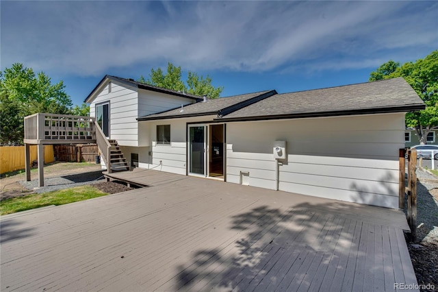 9605 Carr St, Broomfield, CO 80021 - tri-level home featuring a deck, stairway, and roof with shingles