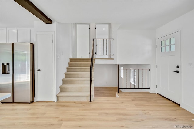 9605 Carr St, Broomfield, CO 80021 - foyer featuring light wood-style floors and stairway
