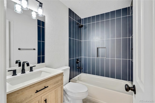 9605 Carr St, Broomfield, CO 80021 - full bathroom with toilet, a textured wall,  shower combination, and vanity