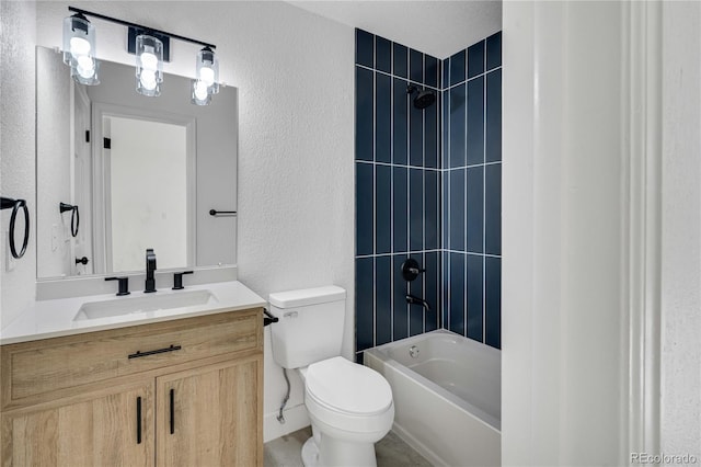 9605 Carr St, Broomfield, CO 80021 - full bathroom featuring toilet, vanity, a textured wall, and  shower combination
