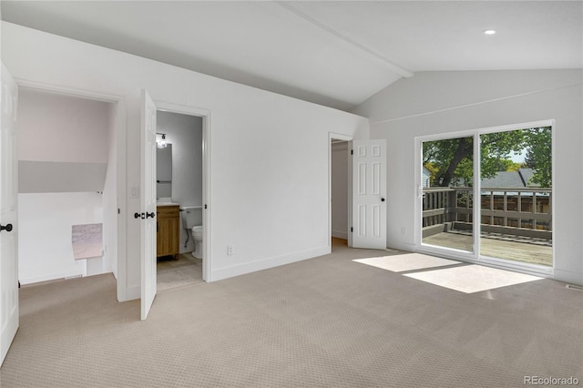 9605 Carr St, Broomfield, CO 80021 - unfurnished bedroom with access to exterior, light colored carpet, baseboards, connected bathroom, and a walk in closet