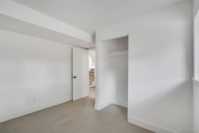 9605 Carr St, Broomfield, CO 80021 - unfurnished bedroom featuring carpet floors, a closet, and baseboards