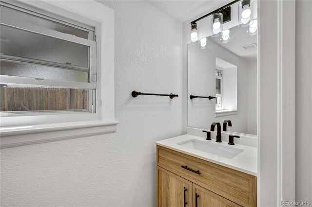 9605 Carr St, Broomfield, CO 80021 - bathroom featuring a textured wall and vanity