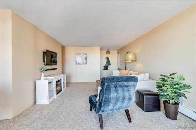 carpeted living room with a baseboard radiator