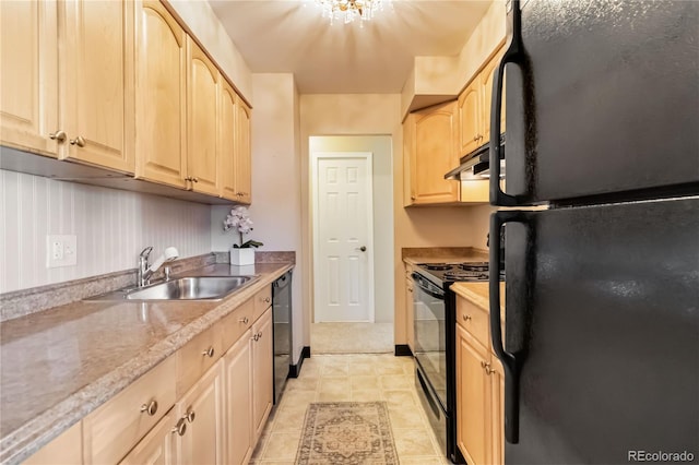 kitchen with light brown cabinetry, sink, and black appliances