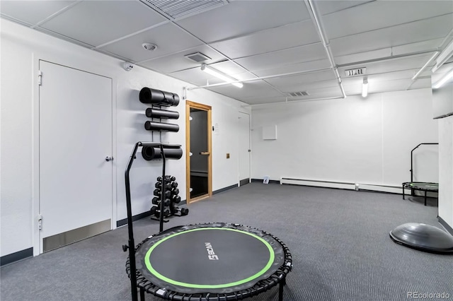 exercise area featuring a baseboard radiator