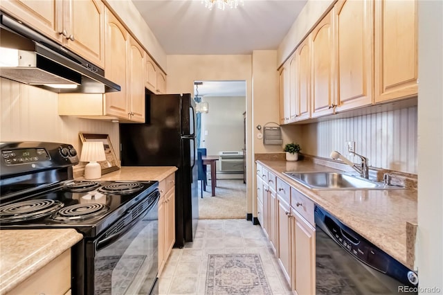 955 Eudora St Unit 708E, Denver, CO 80220 - kitchen featuring black appliances, under cabinet range hood, a sink, and light countertops
