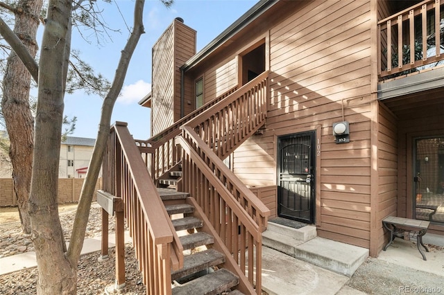 entrance to property with a chimney