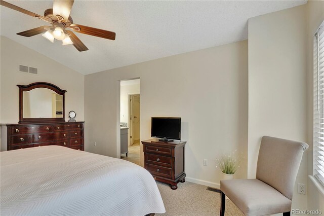 21541 Unbridled Ave, Parker, CO 80138 - bedroom featuring vaulted ceiling, light colored carpet, baseboards, a ceiling fan, and ensuite bath